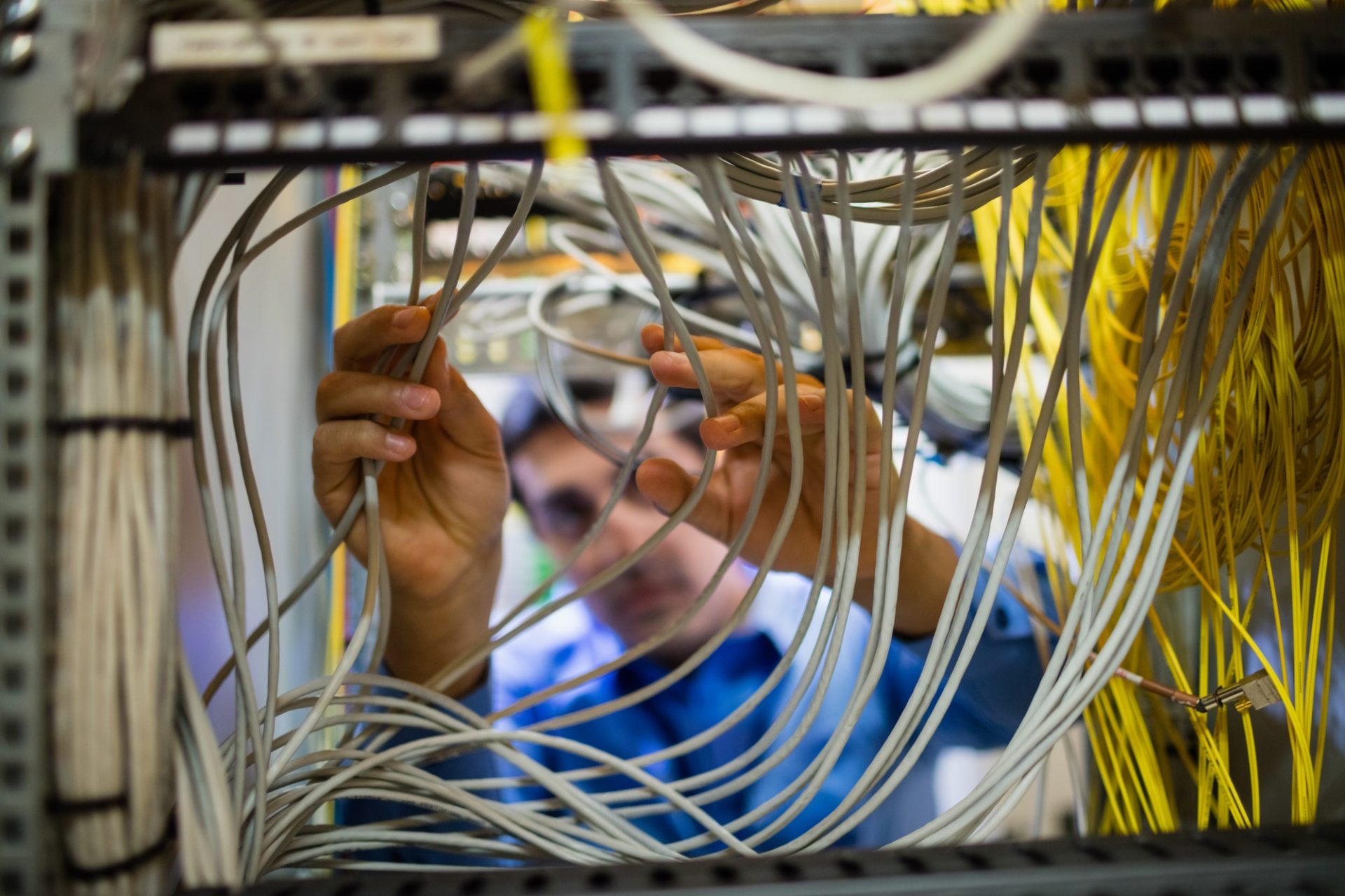 Technician fixing cable